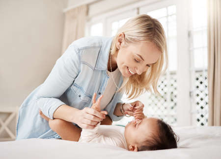 Are you ready for another fun day. a woman bonding with her baby at home.の写真素材