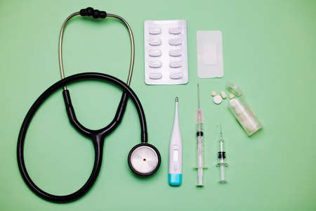 A doctor knows just what you need. medical equipment against a green background.の写真素材
