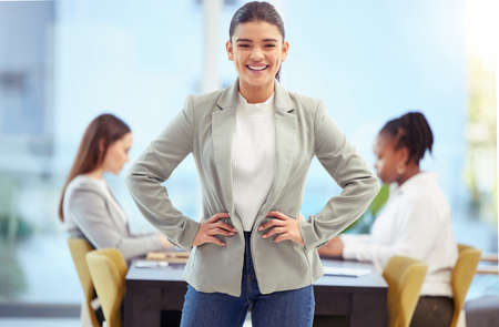 Bad attitudes will ruin your team. a young business woman standing in a board room.