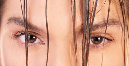 I dont compete for a spot, I am the spot. Cropped portrait of a young woman staring into the camera with wet hair.の写真素材