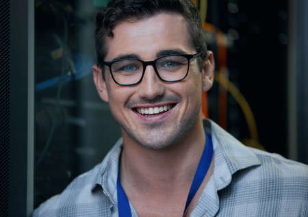 I speak the language of computers. Cropped portrait of a handsome young male programmer working in a...