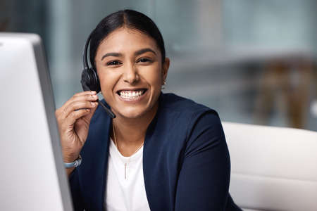 Excellent service is what youll always receive. Portrait of a young businesswoman working on a...