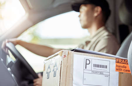 Keeping your packages safe. a delivery man driving to drop off a package.
