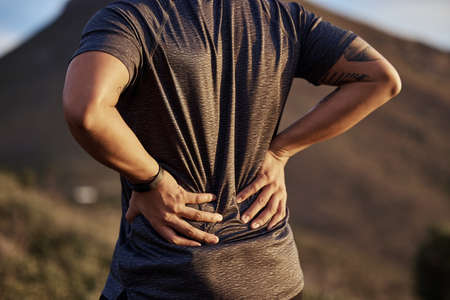 It might be time for a quick break. a young man exercising in nature.の写真素材