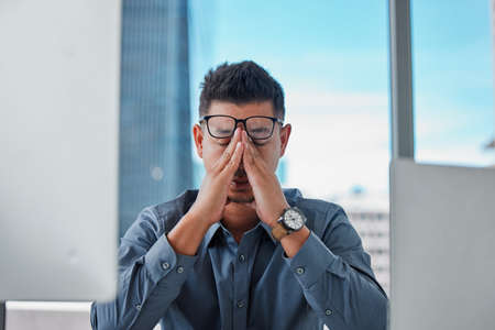 I shouldnt have let this happen. a handsome young businessman sitting alone in the office and...