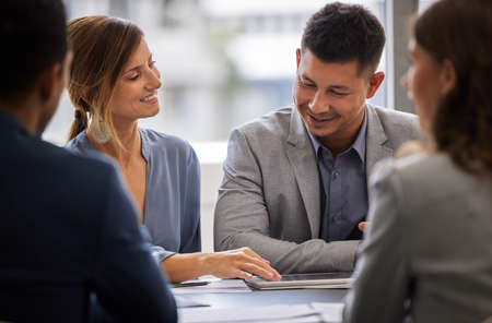 I think you just came up with a brilliant idea. a diverse group of businesspeople sitting together in the office and having a meeting.の写真素材