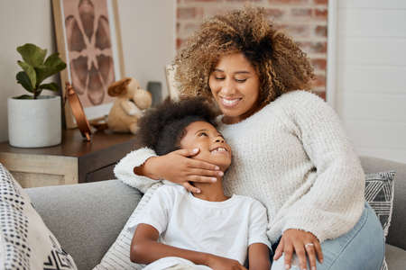 No matter your age, you always need your mom. a mother and daughter sitting on the couch.