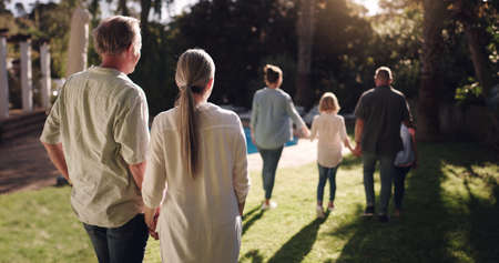 Weve built a dream life together. a family enjoying the sunset in their backyard.の写真素材