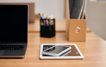 Wireless technology is the key to business success. Still life shot of wireless technology on a desk in an office.の写真素材