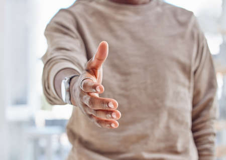 Take my hand and Ill lead you to better opportunities. an unrecognizable person extending their hand for a handshake.の写真素材