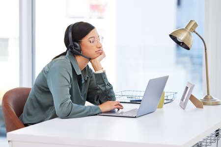 Man Ive hit a wall. a businesswoman working in a call center.