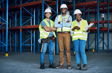 Our combined construction skills give us the competitive edge. Portrait of a group of builders...