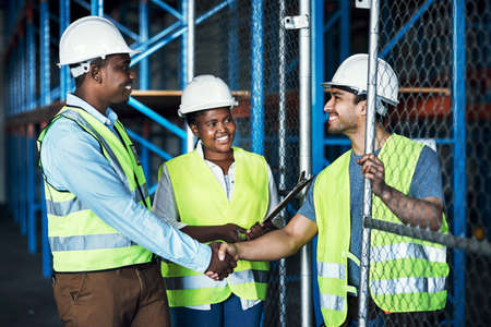 To build the best, work with the best. builders shaking hands at a construction site.