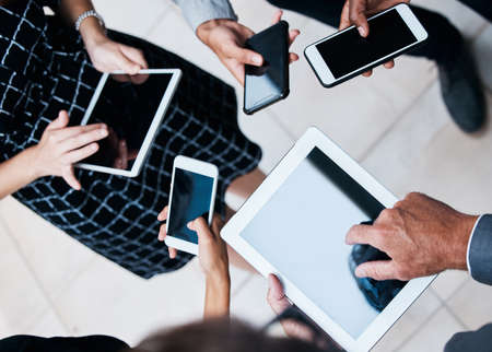 A small device can create such big opportunities. the hands of businesspeople using various devices.