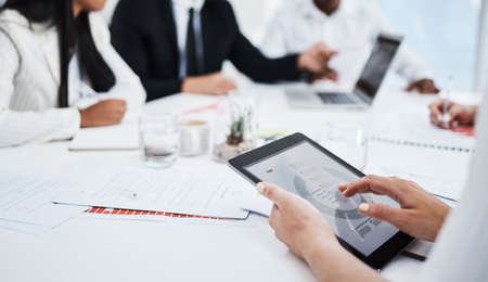 Get quick access to your data at a simple touch. Closeup shot of an unrecognisable businesswoman...