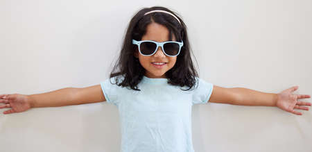 Im not just a little cute, Im this much cute. an adorable little girl wearing sunglasses while...