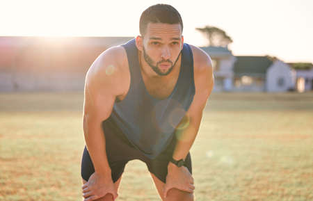 Im willing to work for it. a young man looking exhausted while out for a run.