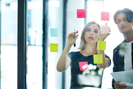 Businesspeople in brainstorm, thinking and planning session in a modern office. Creative team...