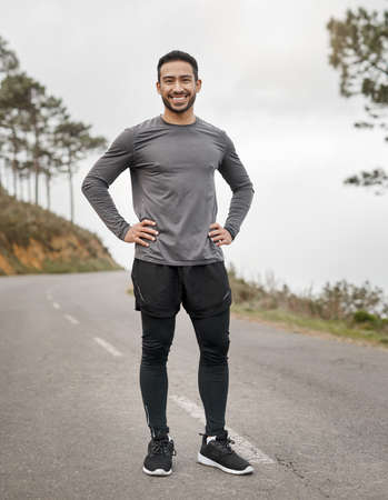 My only competition is myself. Full length portrait of a handsome young man standing alone after his...
