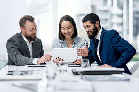 Digging deeper into a wider net of possibilities. a group of businesspeople working together on a...
