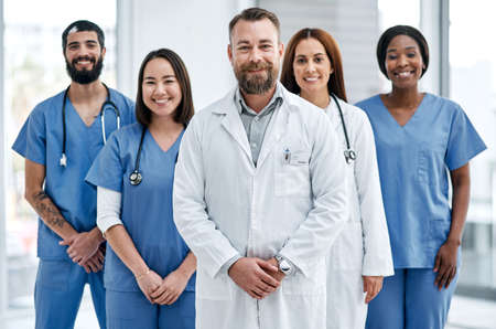 Delivering integrated care that makes a difference. Portrait of a group of medical practitioners...