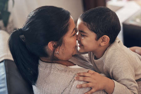 In a childs eyes, a mother finds paradise. an adorable little boy spending quality time with his mother at home.の写真素材
