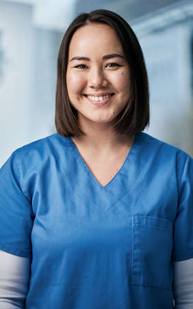 Embodying the core values of a good doctor. Portrait of a medical practitioner standing in a hospital.の写真素材