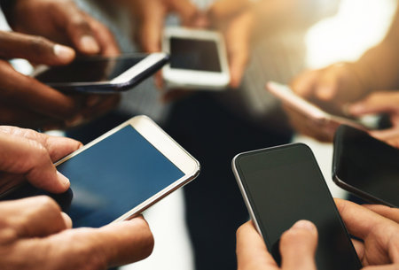 Closeup of business people hands typing on a phone, texting on social media or reading emails or...