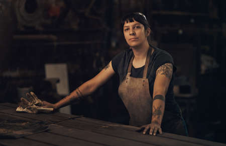 Give me tools over tiaras any day. Portrait of a confident young woman working at a foundry.