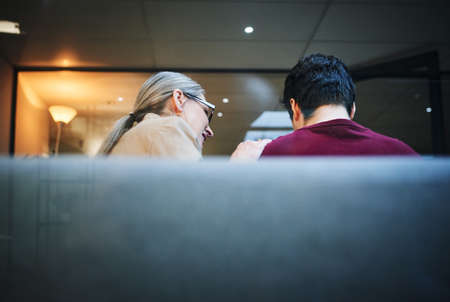 With the right help, the healing process can begin. a young man being comforted by his psychologist during a therapeutic session.の写真素材
