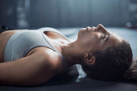 Tomorrow is another chance to be better. a young woman taking a break from her workout at the gym.