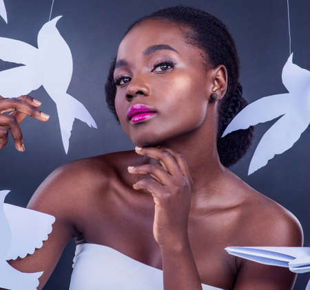 Beauty begins the moment you decide to spread your wings. Studio portrait of a beautiful young woman...