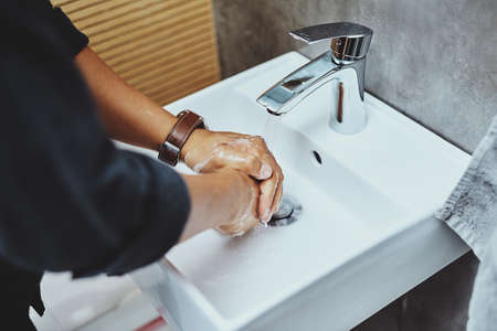 Step number one to staying healthy Put your hygiene first. an unrecognisable man washing his hands...