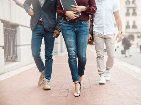 Big movements lead to big success. a group of unrecognisable businesspeople walking through the...