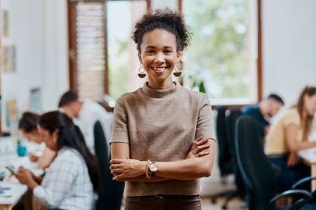 Ive never been more proud of my team. Portrait of a confident young businesswoman working in a...