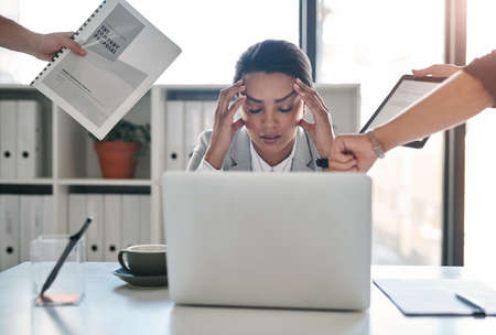 The pressure is getting the best of her. an attractive young businesswoman feeling stressed out in a...