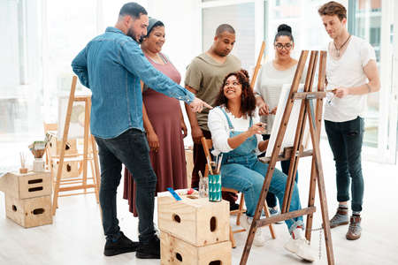 I like how that looks. Full length shot of an attractive young woman sitting and explaining her...