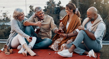 Wine is the perfect thing for this moment. Full length shot of an affectionate family having wine...