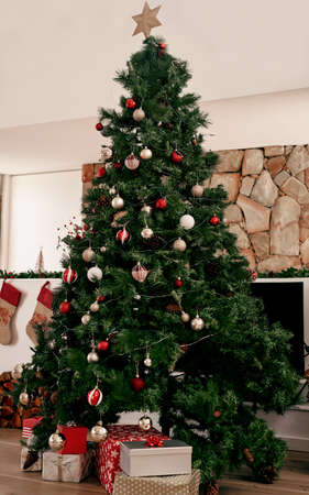 We did well on the decorating. a bunch of presents placed under a Christmas tree ready to be opened in the morning.の写真素材