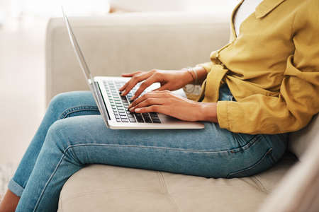 I am always creating. an unrecognizable businesswoman sitting on her couch and blogging from her...