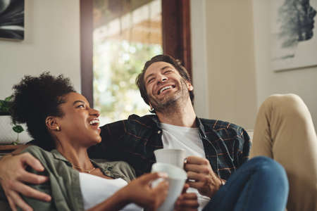 Coffee and conversations. a happy young couple drinking coffee and spending some quality time...