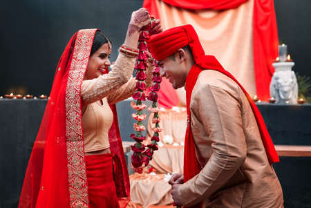 This ceremony is the meeting of two souls. a young hindu couple on their wedding day.の写真素材