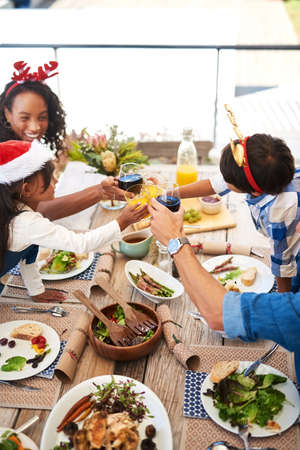 Sharing special moments with special people. High angle shot of a beautiful young family sharing a...