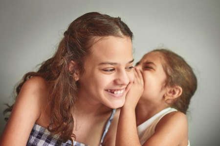 I tell her all my secrets. two young girls spending time together at home.の写真素材