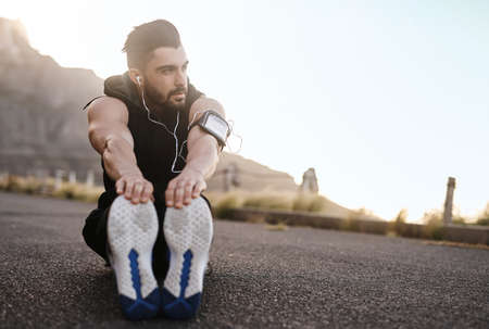 Good days start with a good workout. a sporty young man exercising outdoors.