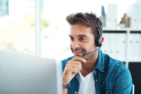 He has a solution for everything. an attractive young call centre agent working in his office.