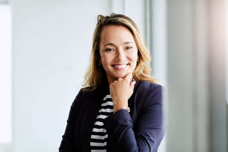 She finds success in every venture she pursues. Portrait of an attractive businesswoman posing with...