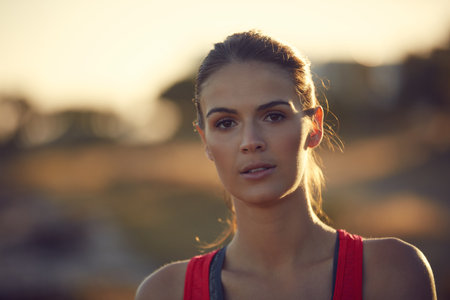 I set a new goal for myself. Portrait of a sporty young woman exercising outdoors.の写真素材