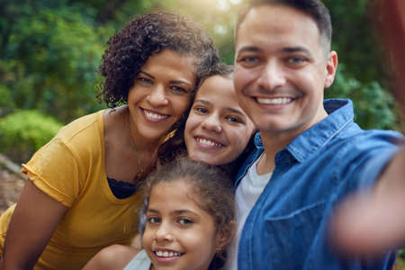 Nothing sweeter than a family selfie. Cropped portrait of a happy family taking a selfie at the...