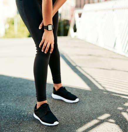 Its game over for my workout until I get this treated. Closeup shot of a sporty young woman holding...